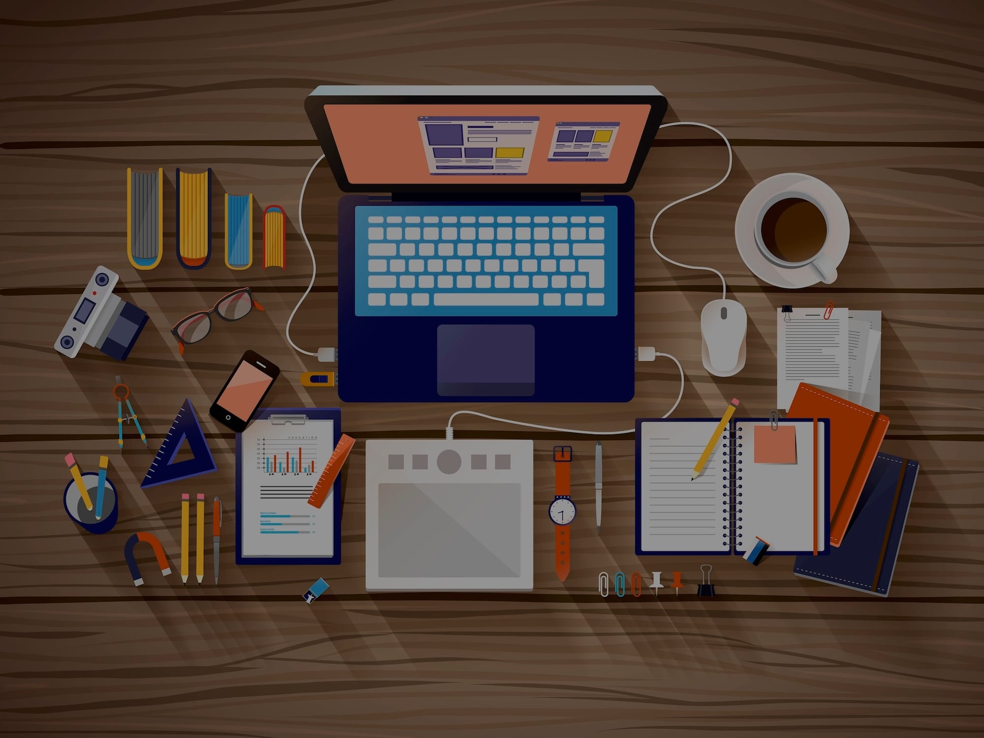 A writer's desk with a laptop, books, stationery, and coffee.